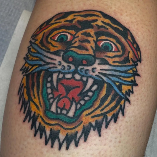 Small American Traditional Tiger Head on Men Leg Tattoo by @dorianbakertattoos