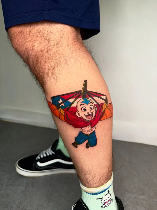Small Anime Aang on Men Leg Tattoo by @hannytattoo_ny