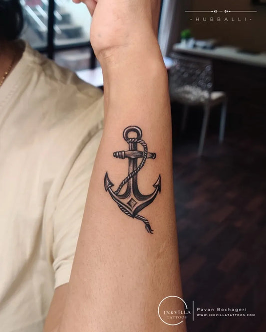 Small Black and Grey Anchor Tattoo on Men Wrist by @inkvilla_tattoos_hub
