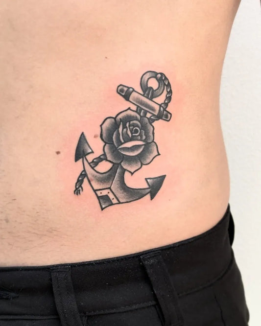 Small Black and Grey Anchor and Rose Tattoo on Men Waist by @paulo_borrega