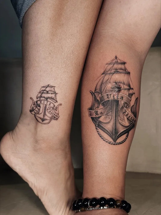Small Black and Grey Anchor and Ship Tattoo on Women Leg by @inkcrafttattoomalaysia