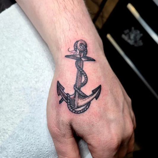 Small Black and Grey Anchored Rope Nautical Tattoo on Men Wrist by @before_the_mast