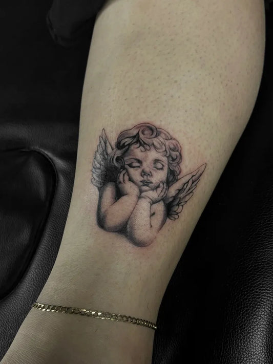Small Black and Grey Angel on Women Arm Tattoo by @gloreeangelle