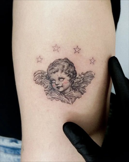 Small Black and Grey Angel with Stars on Women Arm Tattoo by @beckydonnellytattoo