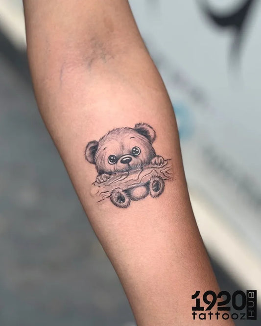 Small Black and Grey Bear on Women Arm Tattoo by @1920tattoozhub