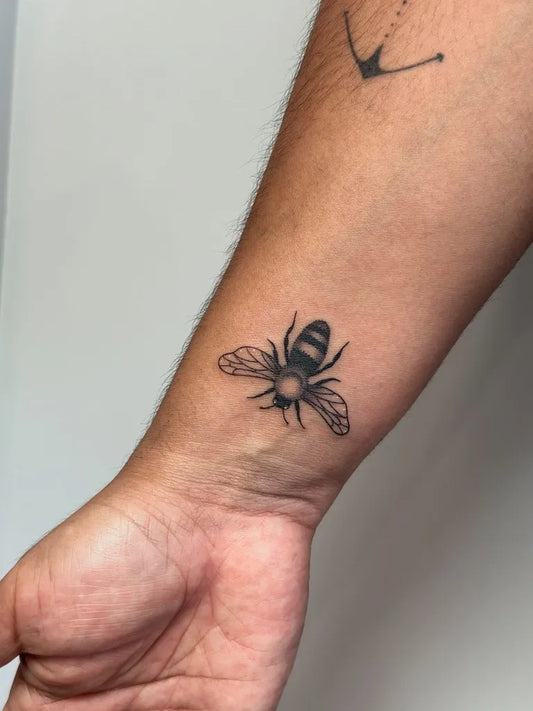 Small Black and Grey Bee and Anchor on Men Forearm Tattoo by @perreault.productions