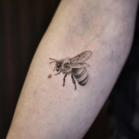 Small Black and Grey Bee on Women Arm Tattoo by @busich