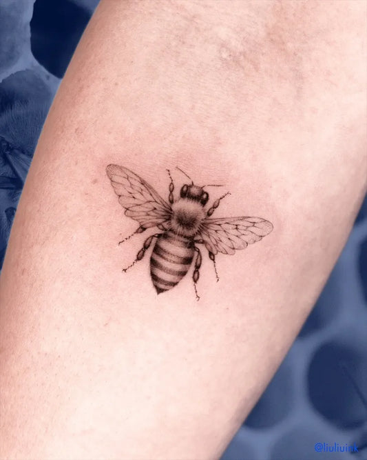 Small Black and Grey Bee on Women Arm Tattoo by @liuliuink