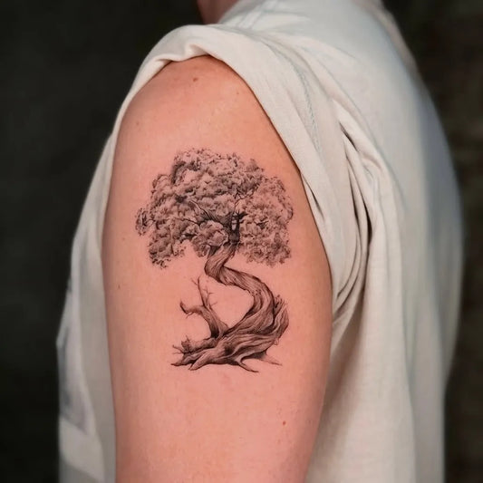 Small Black and Grey Bonsai Tree Tattoo on Men Upper Arm by @yuta.