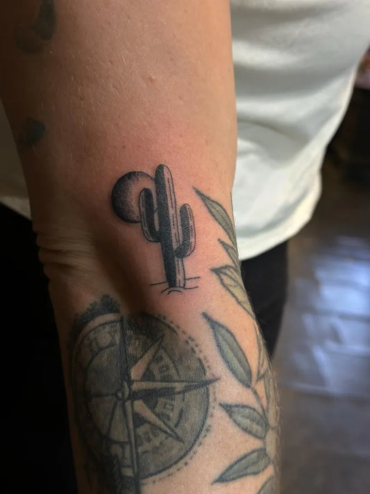 Small Black and Grey Cactus and Moon Tattoo on Men Arm by @witcheshandtattoo