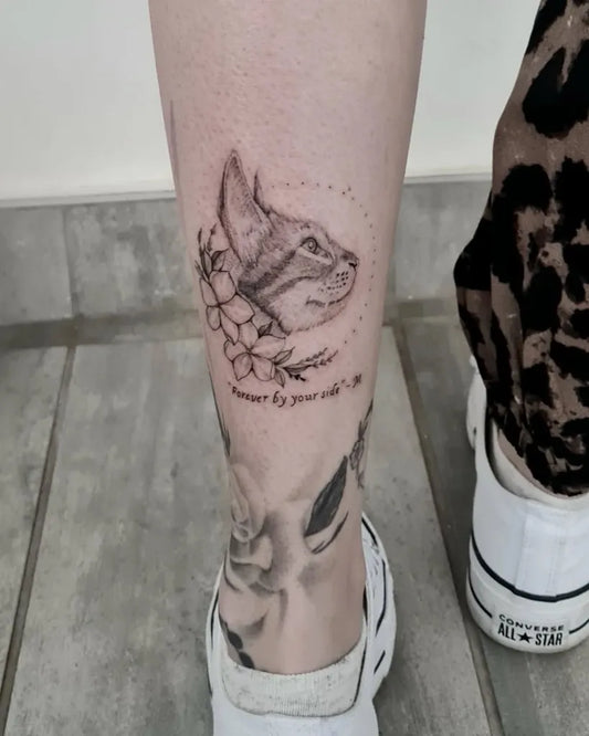 Small Black and Grey Cat and Flowers Tattoo on Women Calf by @kylechelin_houseofink