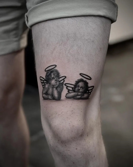 Small Black and Grey Cherub Tattoo on Men Leg by @beaubarkertattoo