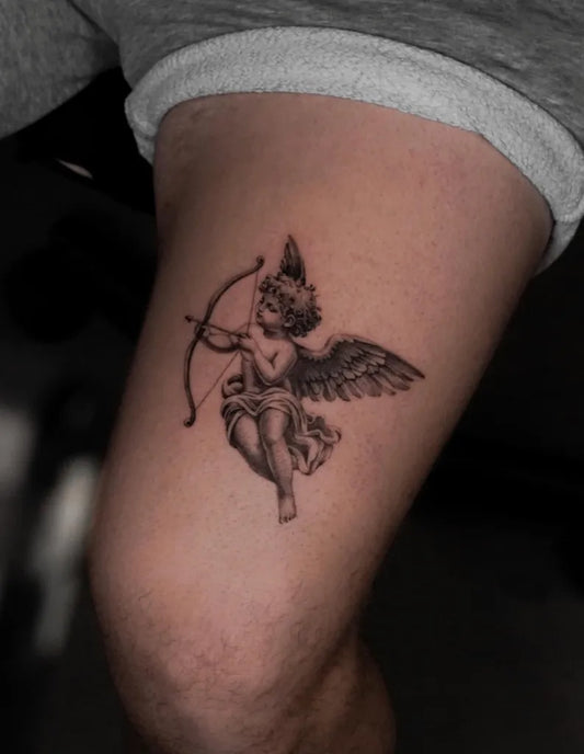 Small Black and Grey Cherub with Bow and Arrow Tattoo on Men Thigh by @willfinchdesign