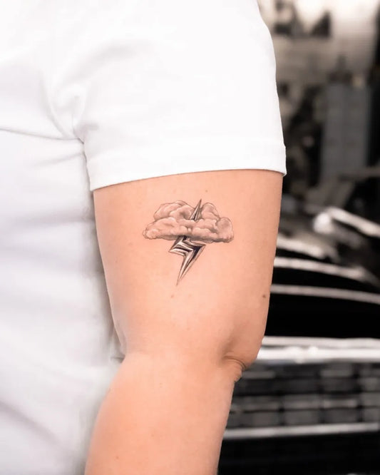 Small Black and Grey Cloud Lightning Tattoo on Women Arm by @cristinasantats