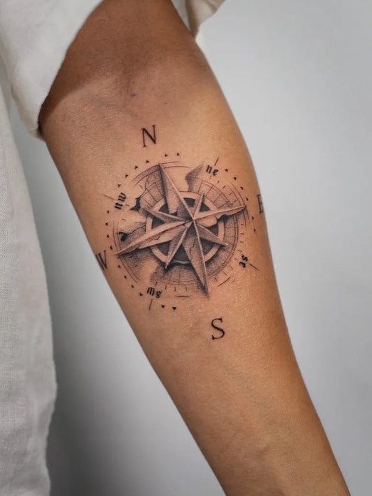 Small Black and Grey Compass on Men Arm Tattoo by @baronart_alan