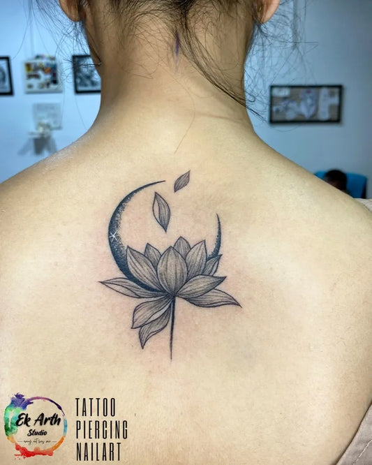 Small Black and Grey Crescent Moon Lotus Tattoo on Women Back by @ekarthstudio