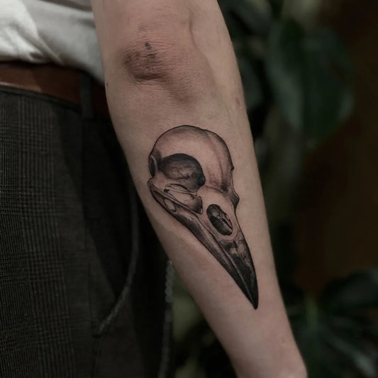 Small Black and Grey Crow Skull Tattoo on Men Arm by @darkcrowtattoo
