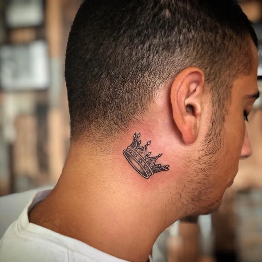 Small Black and Grey Crown Tattoo on Men Neck by @tattoo28_ashdod