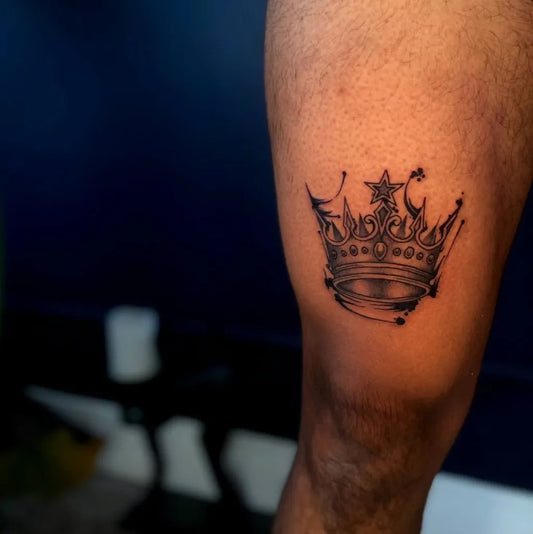 Small Black and Grey Crown Tattoo on Men Thigh by @odalisquestudios