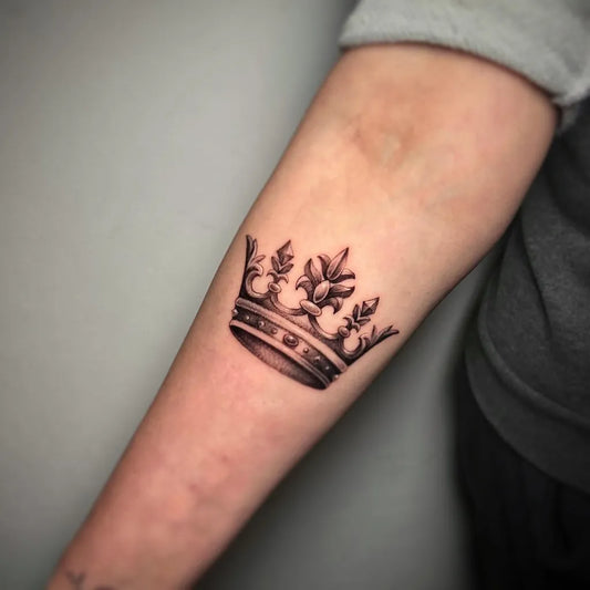 Small Black and Grey Crown Tattoo on Women Arm by @antoniomas