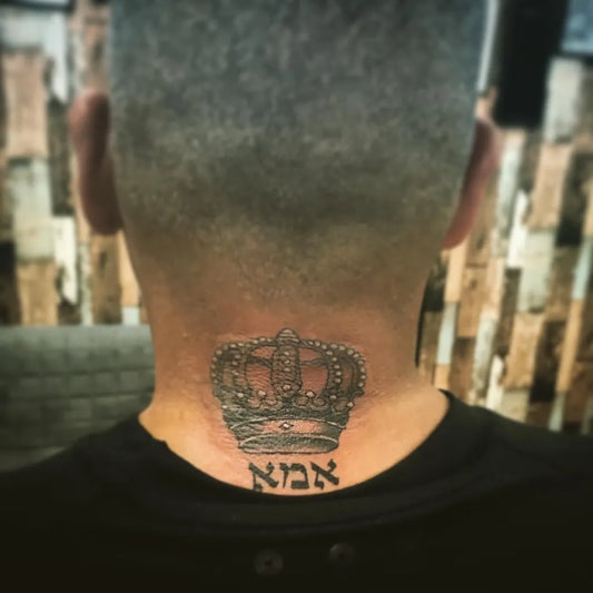 Small Black and Grey Crown with Hebrew Script Tattoo on Men Neck by @tattoo28_ashdod