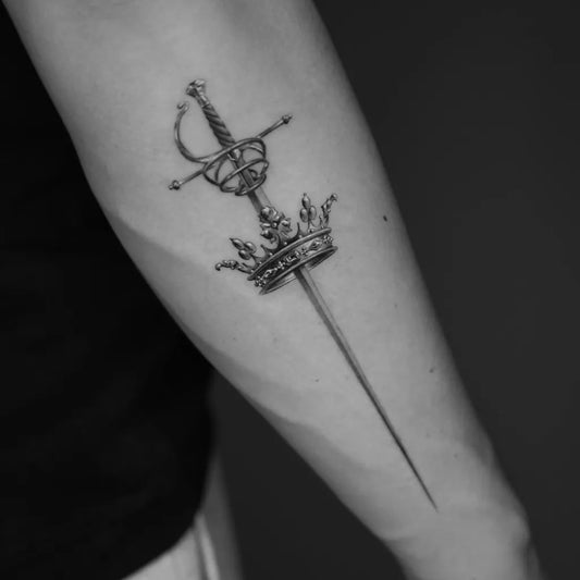 Small Black and Grey Crowned Sword on Women Arm Tattoo by @911214lu