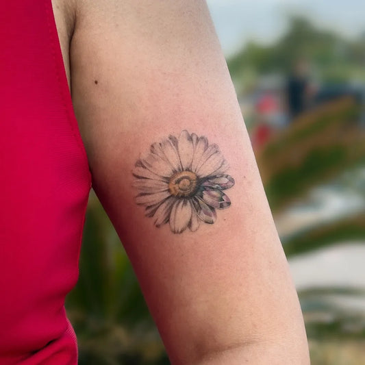Small Black and Grey Crystal Daisy Tattoo on Women Arm by @mervegulink