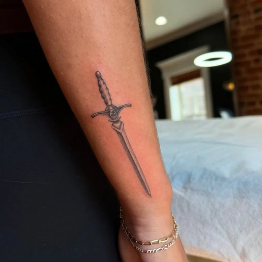 Small Black and Grey Dagger Tattoo on Women Forearm by @blackwingtattooco