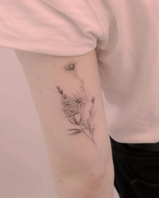 Small Black and Grey Daisy Flowers Tattoo on Women Arm by @tattooist_hea