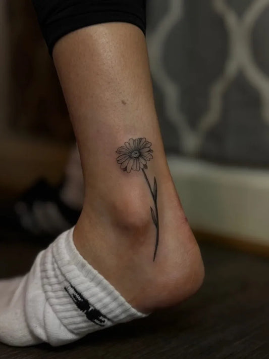 Small Black and Grey Daisy Tattoo on Women Ankle by @percyjems