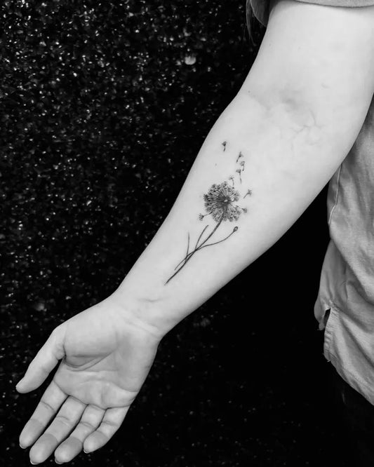 Small Black and Grey Dandelion Tattoo on Women Forearm by @arcandcurve802
