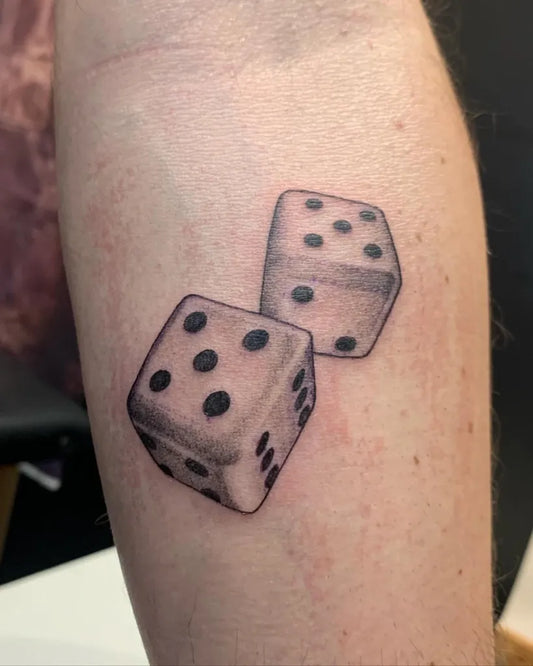 Small Black and Grey Dice Tattoo on Men Arm by @jube.tattoo