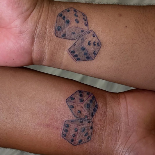 Small Black and Grey Dice Tattoo on Women Wrist by @neckdeeptattoohi