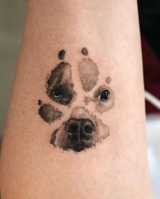 Small Black and Grey Dog Paw Print Tattoo on Women Forearm by @tattooist_kimria