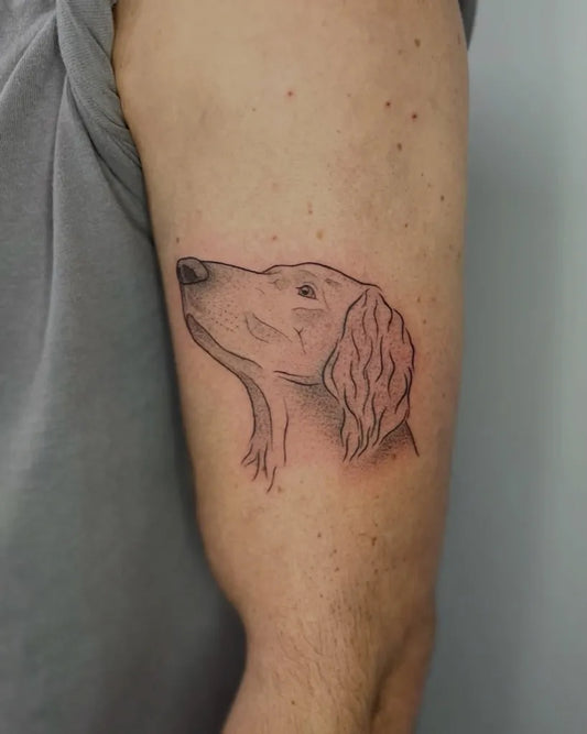 Small Black and Grey Dog Tattoo on Men Arm by @nickymarijnetattoo