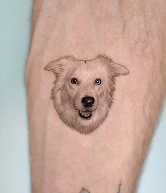Small Black and Grey Dog Tattoo on Men Leg by @zeal_tattoo