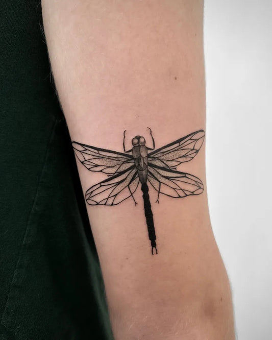 Small Black and Grey Dragonfly on Women Arm Tattoo by @extrahottattoo