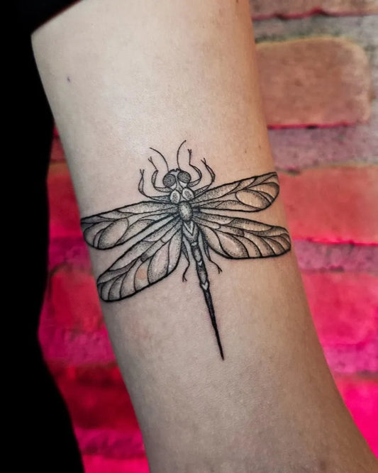 Small Black and Grey Dragonfly on Women Arm Tattoo by @luciahtattoo