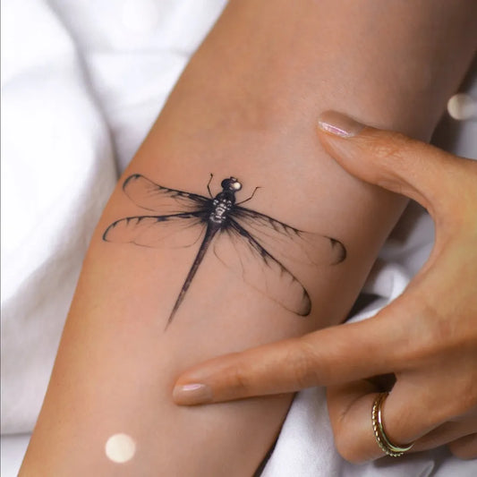 Small Black and Grey Dragonfly on Women Arm Tattoo by @steff_ink