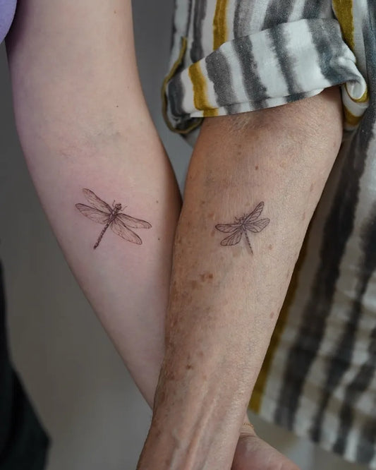 Small Black and Grey Dragonfly on Women Arm Tattoo by @tattoobysoso
