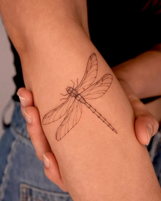 Small Black and Grey Dragonfly on Women Arm Tattoo by @tattooist_hyn