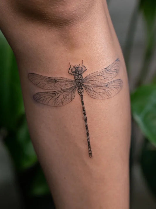 Small Black and Grey Dragonfly on Women Thigh Tattoo by @inkdbymaryann