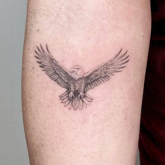Small Black and Grey Eagle Tattoo on Men Arm by @gldn.ink_