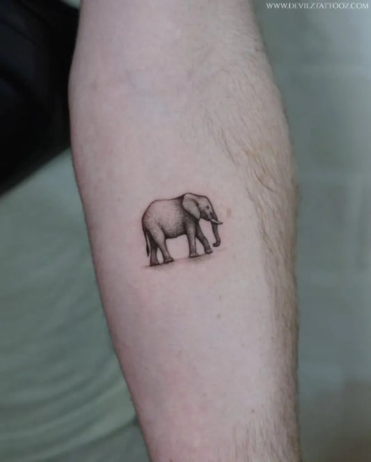 Small Black and Grey Elephant Tattoo on Men Arm by @devilztattooz