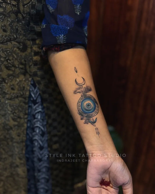 Small Black and Grey Evil Eye Crescent on Women Arm Tattoo by @indrajeet_chakraborty