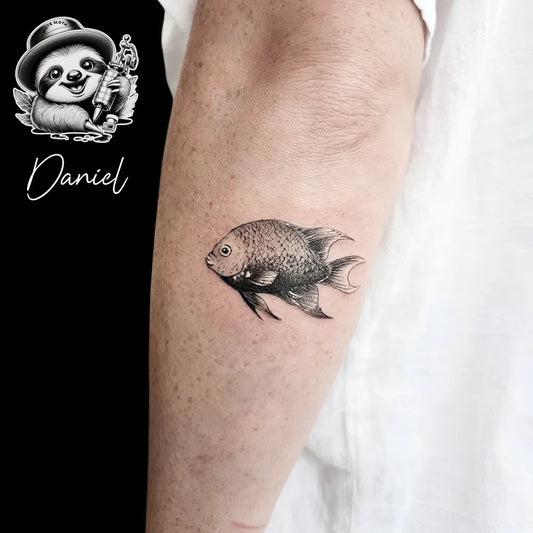 Small Black and Grey Fish Tattoo on Men Arm by @whitesloth.tattoo
