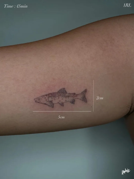 Small Black and Grey Fish Tattoo on Women Arm by @joedelawave