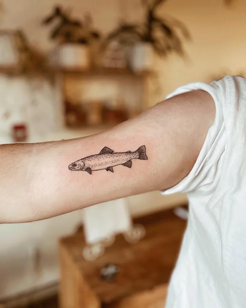 Small Black and Grey Fish Tattoo on Women Arm by @overzealous.ink