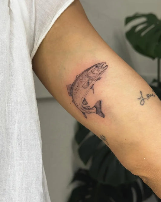 Small Black and Grey Fish Tattoo on Women Arm by @wallflower.tattoo