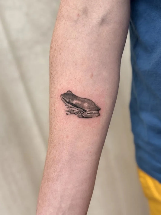Small Black and Grey Frog Tattoo on Men Arm by @amberpokes